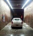 LED-lit car wash bay providing bright illumination for night washing